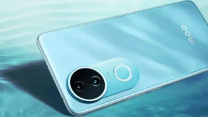iQOO Z10R Set to Launch in India Soon: Teased With Dual Cameras, Curved Display, 4K Vlogging Support 2 Close-up of the back of a light blue iQOO Z10R smartphone, highlighting its camera module and iQOO branding.
